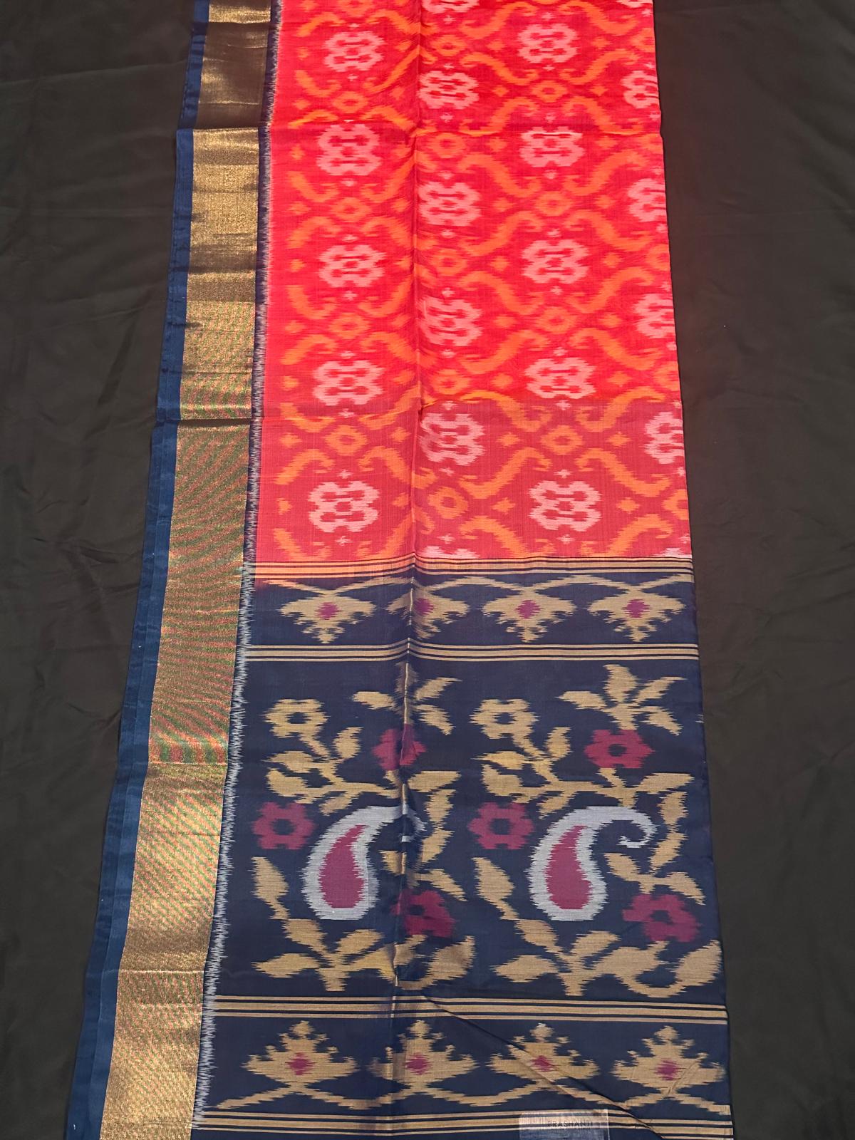 Ikat silk cotton saree orange and dark blue with allover ikat weaves and long ikat woven zari border