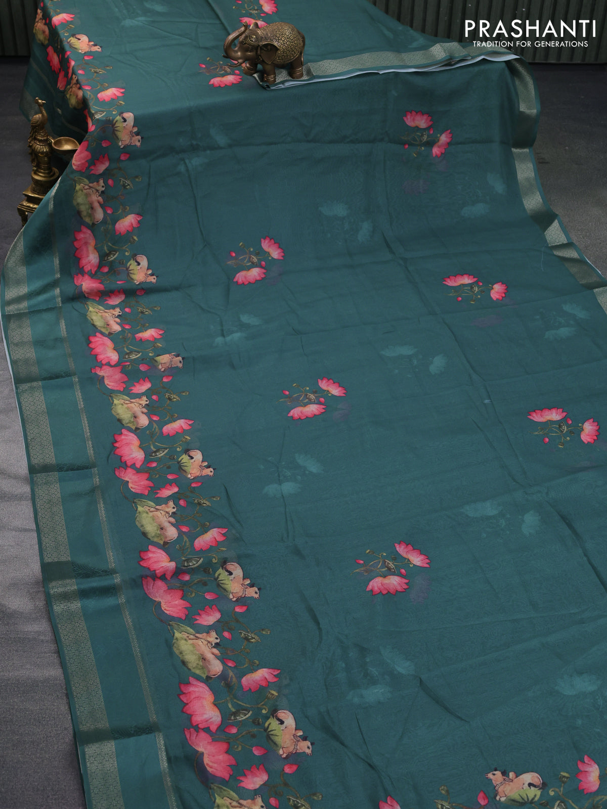 Semi georgette saree peacock green with pichwai prints and rettapet zari woven border