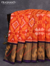 Ikat silk cotton saree rustic orange and dark blue with allover ikat weaves and long ikat woven zari border