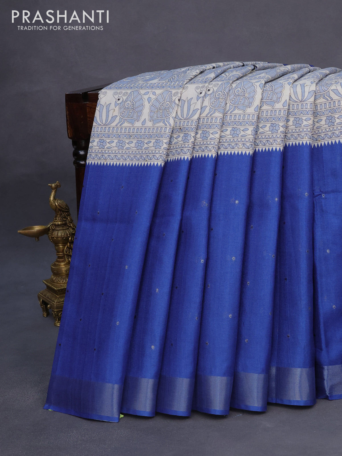 Semi tussar saree off white and blue with madhubani prints & zari buttas and zari woven border