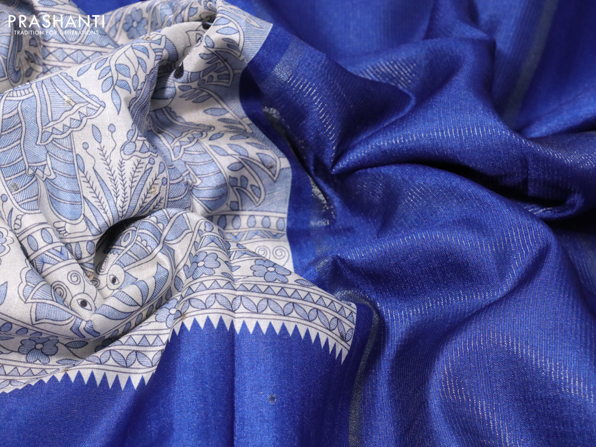 Semi tussar saree off white and blue with madhubani prints & zari buttas and zari woven border