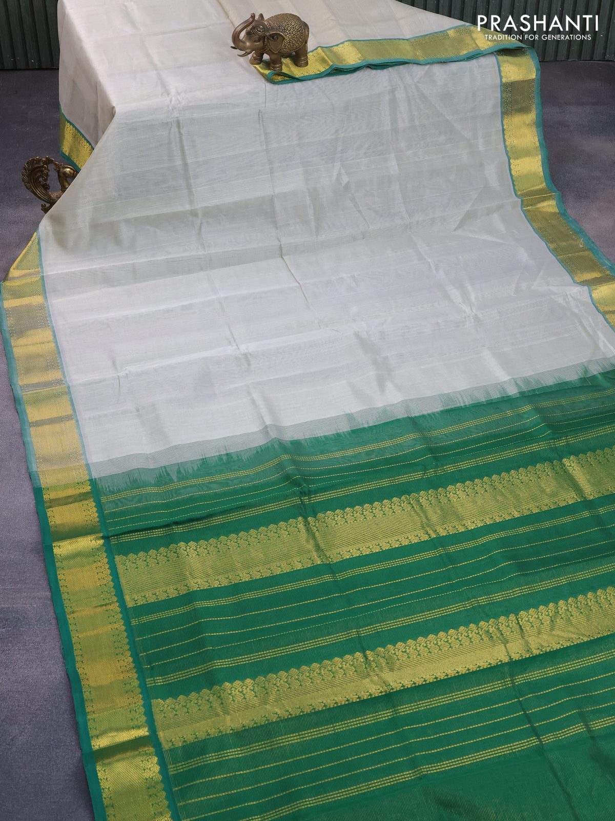 Silk cotton saree grey and green with allover vairaosi pattern and zari woven border