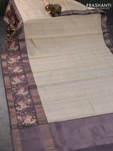 Semi chiniya silk saree cream and greyish brown with allover zari woven buttas and long zari woven floral printed border