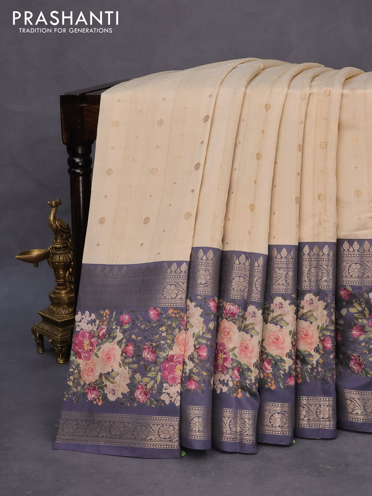 Semi chiniya silk saree cream and dark grey with allover zari woven buttas and long zari woven floral printed border