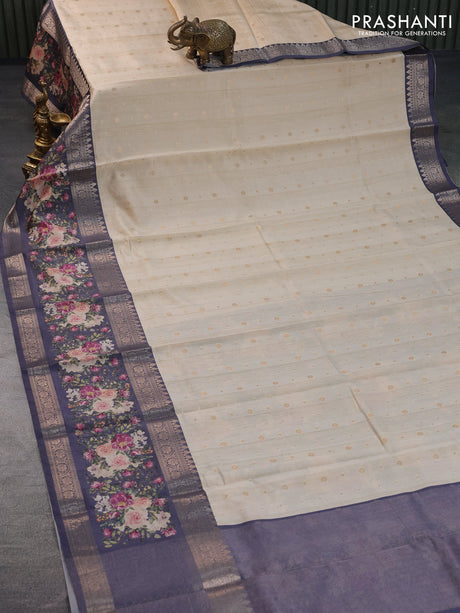 Semi chiniya silk saree cream and dark grey with allover zari woven buttas and long zari woven floral printed border