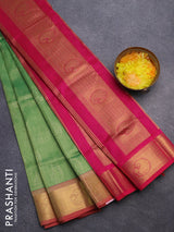 Silk cotton saree green shade and magenta pink with allover self emboss jacquard and rich zari woven border