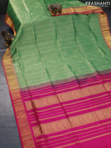 Silk cotton saree green shade and magenta pink with allover self emboss jacquard and rich zari woven border