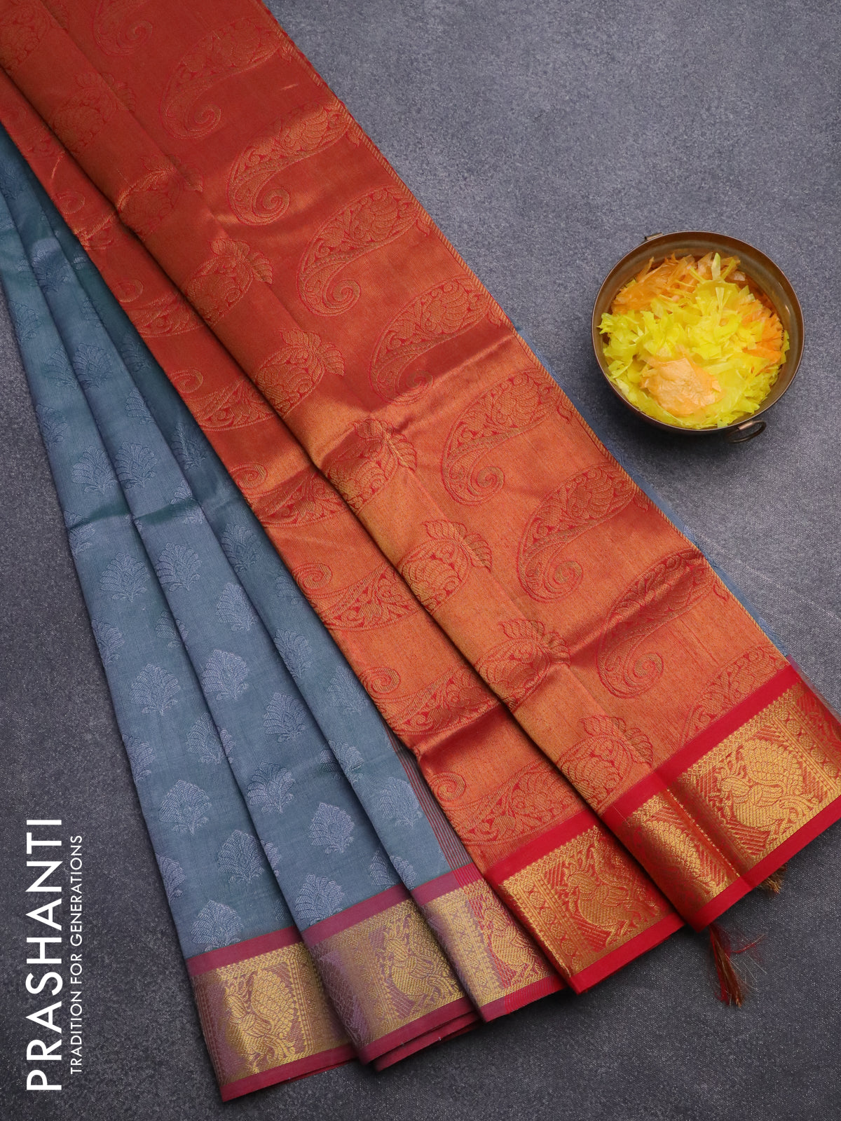 Silk cotton saree dual shade of greish green and red with allover self emboss jacquard and annam zari woven border