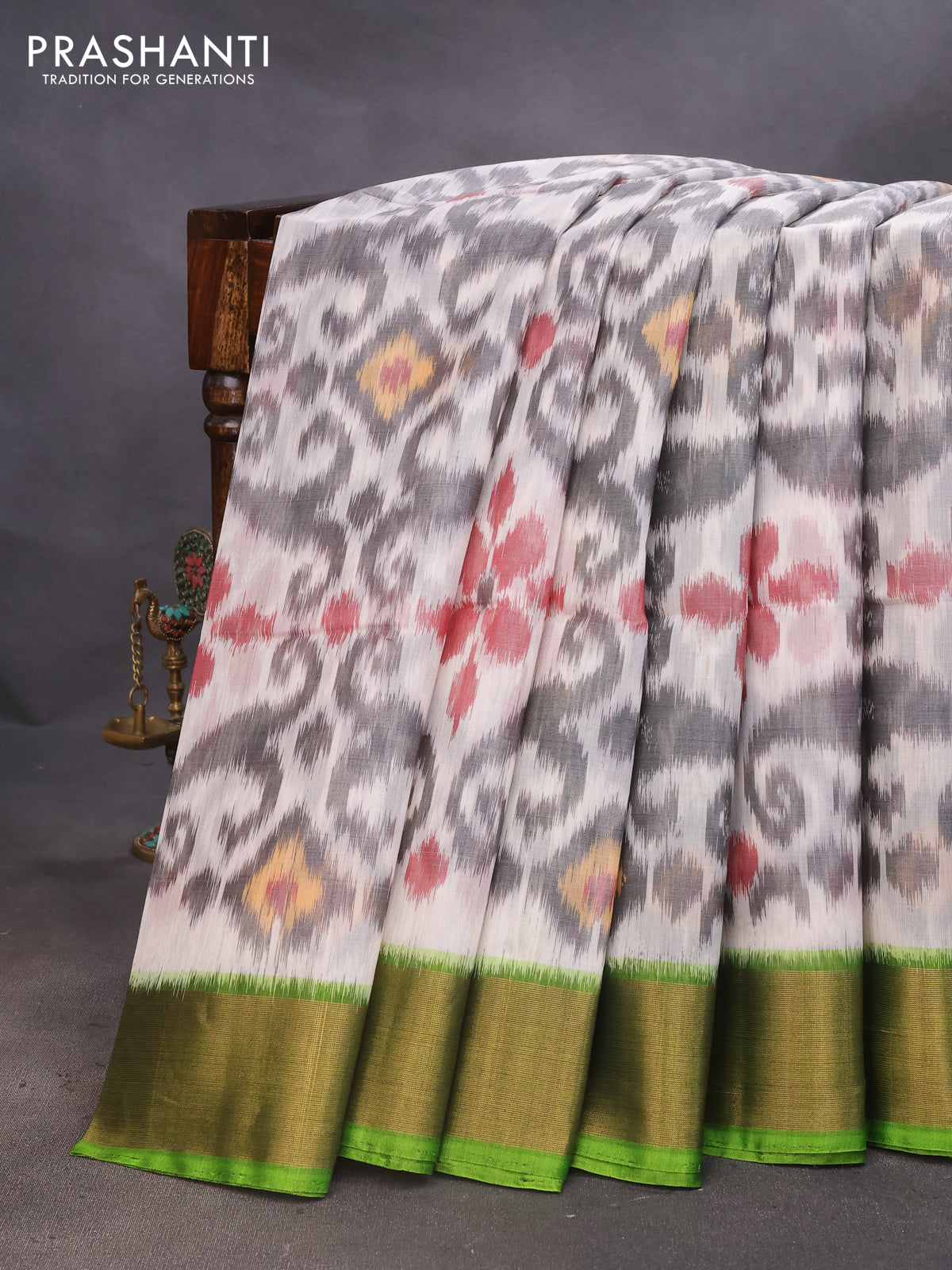 Ikat silk cotton saree off white grey and light green with allover ikat weaves and zari woven border