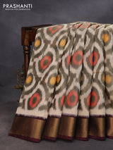 Ikat silk cotton saree cream and deep coffee brown with allover ikat weaves and zari woven border