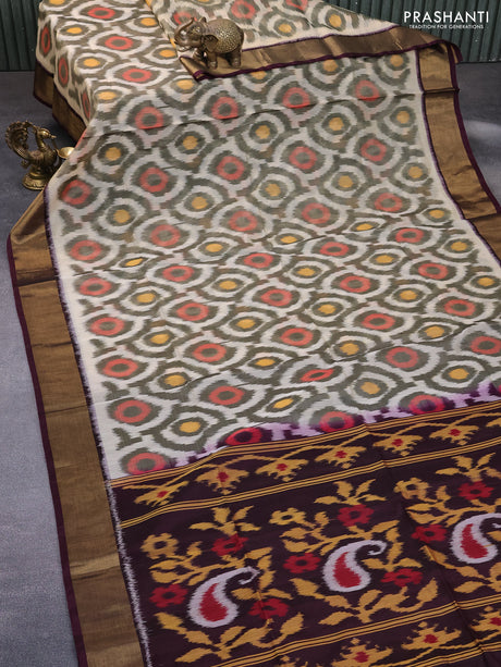 Ikat silk cotton saree cream and deep coffee brown with allover ikat weaves and zari woven border