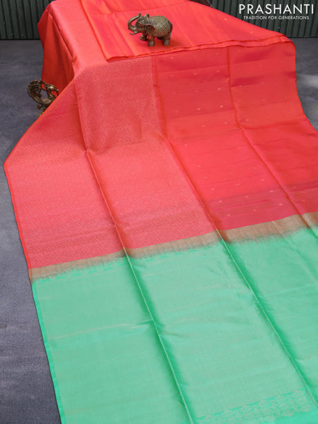 Kanchipuram soft silk saree dual shade of orange and teal green with allover zari weaves in borderless style