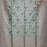 Semi jute silk saree teal blue and beige with allover floral prints woven buttas and woven border