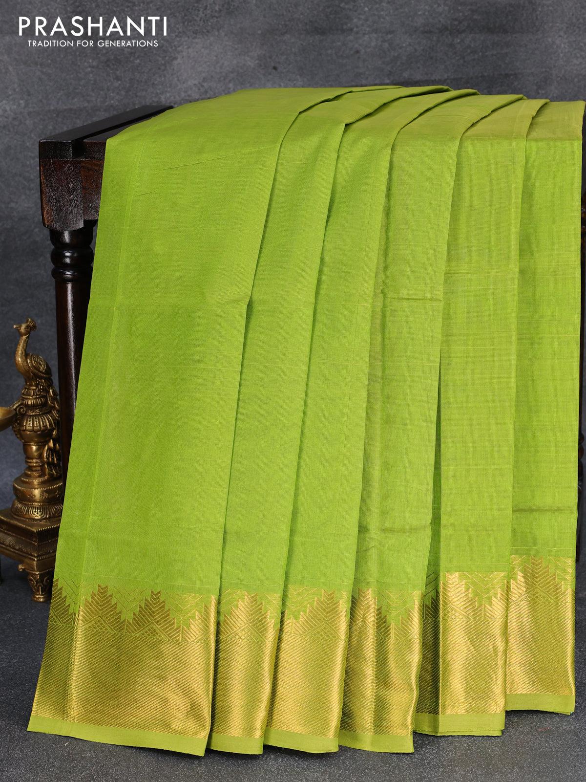 Silk cotton saree light green and pink with plain body and temple design zari woven border