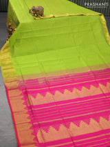 Silk cotton saree light green and pink with plain body and temple design zari woven border